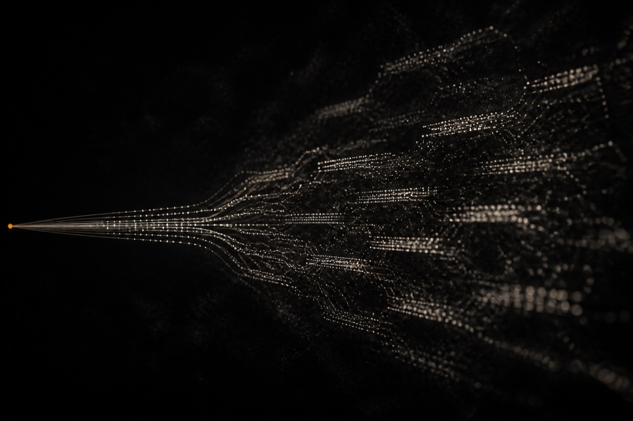 A clean digital signal degrading into scattered noise, with one orange node marking the lock